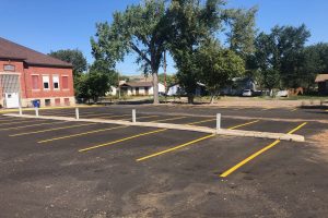 Rows of parking stalls painted in yellow.
